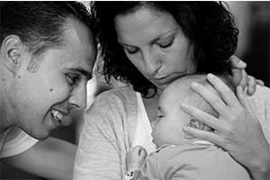 Parents hold and comfort their baby during one of the most trying times of their lives.